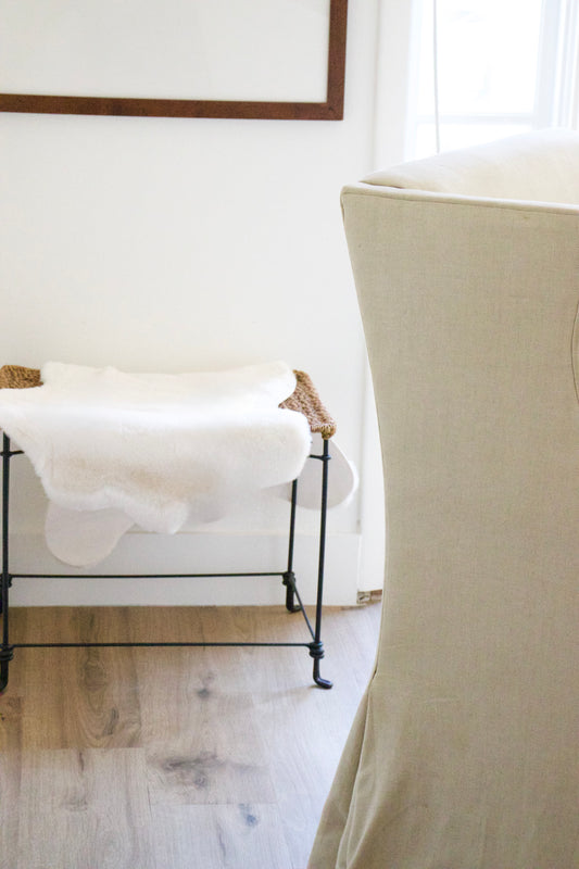 Aged Iron Stool with Sheepskin